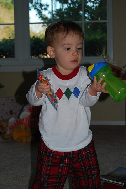 Baby P checking out his stocking stuffers