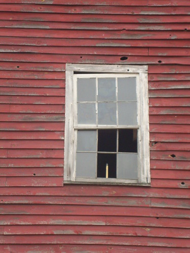 Barn window with candle