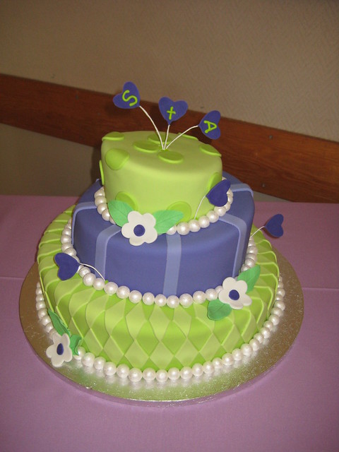 Topsy Turvy 3 Tier Wedding Cake iced in green and purple fondant and 