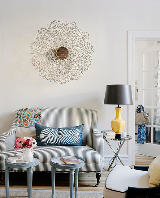 Ideas for small spaces: Loveseat + pops of yellow + decorative mirror