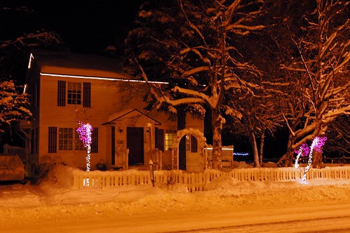 Saltbox style house and pink Christmas trees, picket fence, on 10th Ave, downtown Anchorage, Alaska, USA by Wonderlane