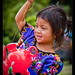 Young girl and her inflatable teletubbie, Guatemala