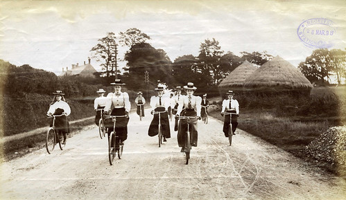 Lady cyclists riding down hill