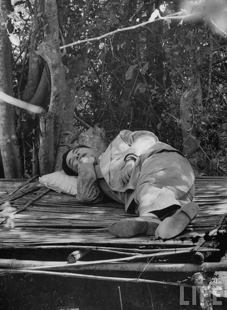 5-1956 South Vietnam's President Ngo Dinh Diem sleeping under the trees during his trip to refugee settlements