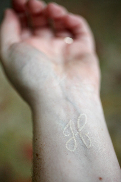 This is my all white ink tattoo on the inside of my left wrist