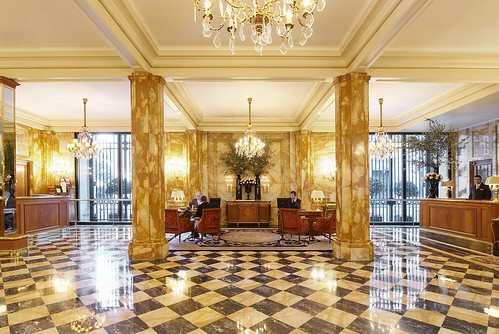 Sumptuous and luxury lobby with checkered black and white polish floor at The Hôtel de Crillon, Paris, France.