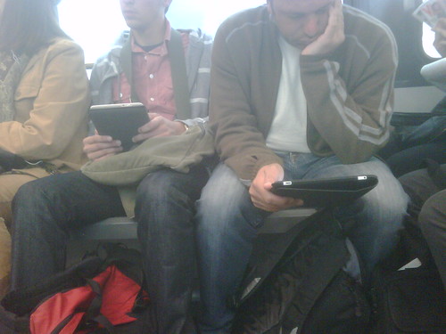 Kindle and iPad on my morning commute. Kindle guy keeps looking over.