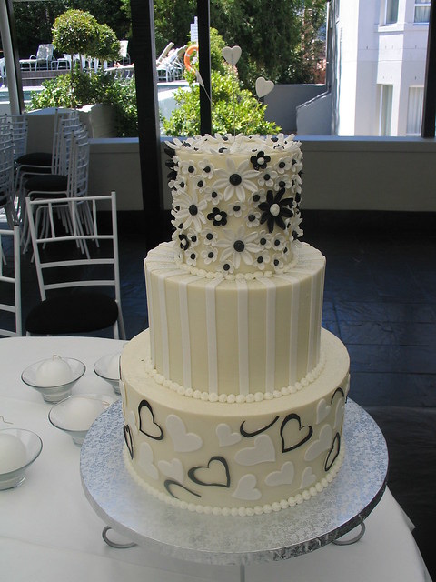 six tiered red black and white wedding cake