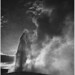 Taken at dusk or dawn from various angles during eruption. "Old Faithful Geyser, Yellowstone National Park," Wyoming. (vertical orientation)