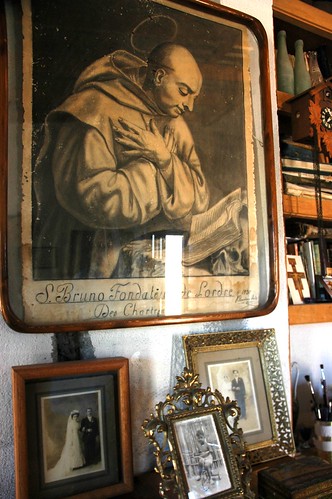 Portrait of San Bruno (Saint Bruno), with Beto Romano's family portraits, at the Serena Hotel, San Bruno, Baja California Sur, Mexico by Wonderlane