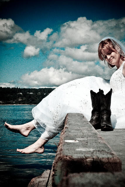 This is Kaitlin with wedding dress and cowboy boots photograhped at the 