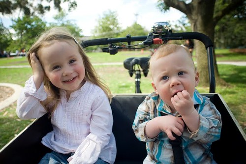 boy and girl sitting in bike seat