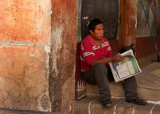 Man reading newspaper in Guatemala