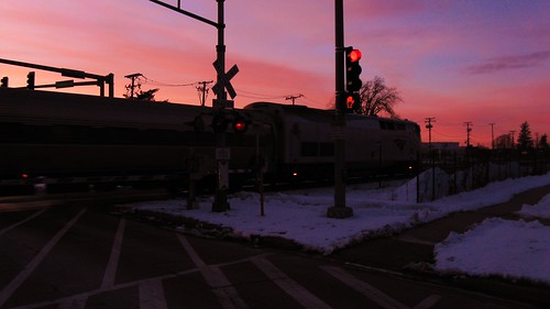 The northbound Amtrak Hiawatha crossing Chestnut Avenue at sunset. Glenview Illinois. February 2010. by Eddie from Chicago