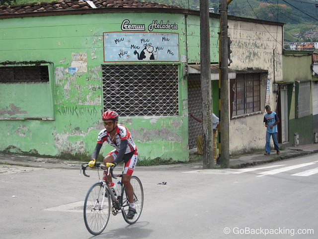 A Colombian cyclist makes his way through a town in the Coffee Region