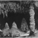 "Two people in background, 'The Rock of Ages in the Big Room,' Carlsbad Caverns National Park," New Mexico.