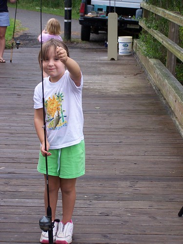 My daughter (then a precocious 5-year-old, now a surly teen) and her first fish caught at College Run Creek during a children's fishing tourney!
