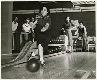 Woman bowling, circa 1950