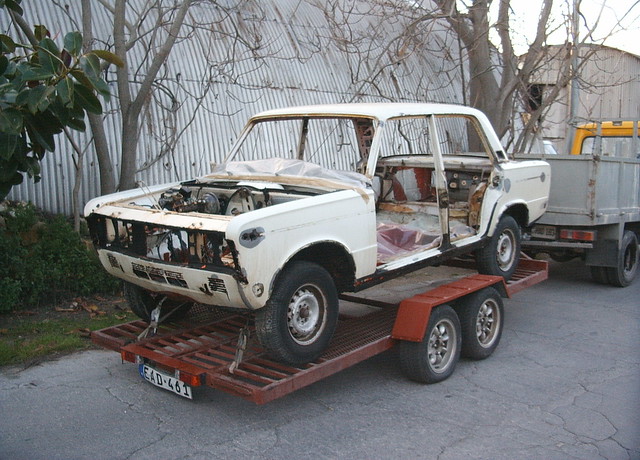 My father's Fiat 125 S going at the panel beater sprayer at Corradino 