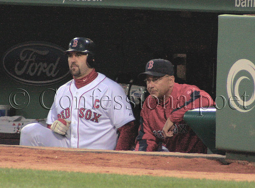 Tek and Tito watch from the dugout