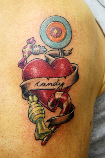 candy heart and scroll tattoo Tattooed by Johnny at The Tattoo Studio