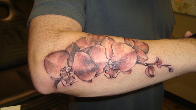 side piece tattoos of flowers
