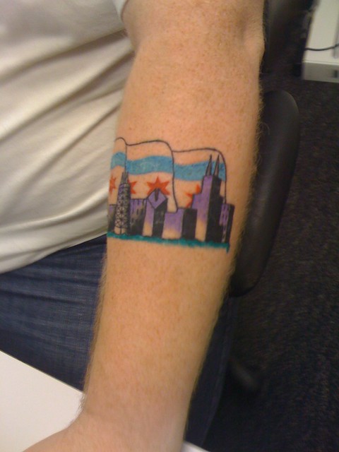 This is my tattoo of the Chicago Skyline and Chicago flag