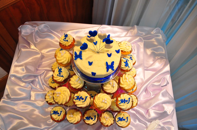Royal blue and ivory wedding Raspberry white choc cupcakes with piped white 