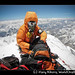 Climber on the summit of Everest with oxygen mask