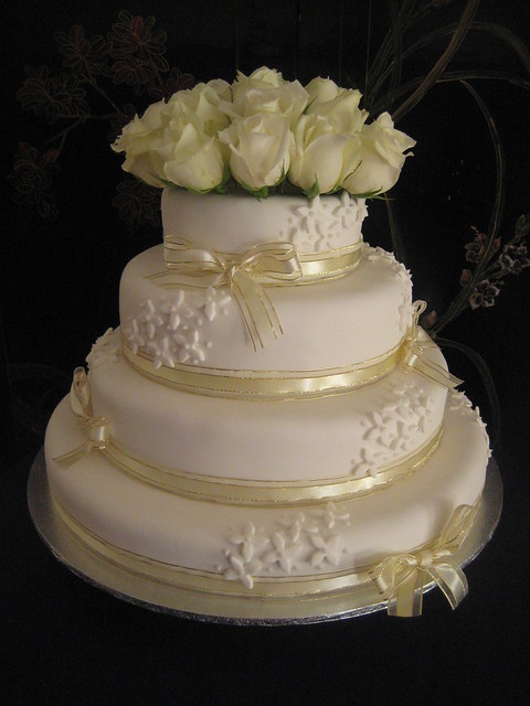 4 tier white gold wedding cake
