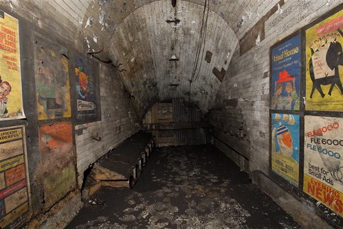 Disused passageway with vintage 1959 posters, Notting Hill Gate tube station, London, 2010