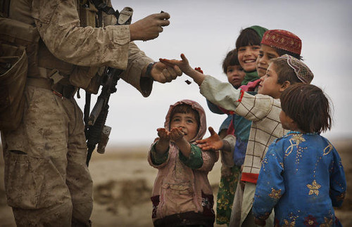 Marine Giving Candy to Children