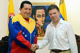 Venezuelan President Hugo Chavez shakes hands with the newly-installed Colombian leader Juan Manuel Santos. The two Latin American states have agreed to restore diplomatic ties. by Pan-African News Wire File Photos