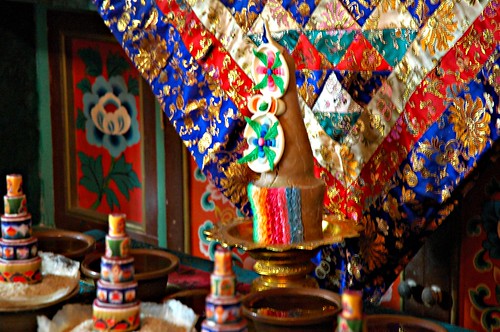 Silk deity cloth and torma set up (white Tara perhaps?), Tharlam Monastery of Tibetan Buddhism, Sakya Lamdre, Boudha, Kathmandu, Nepal by Wonderlane
