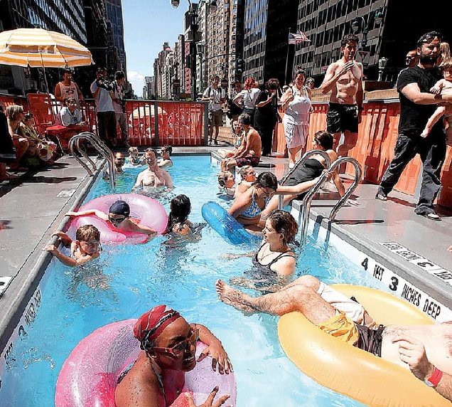Portable pool crafted from an old dumpster, New York City.
