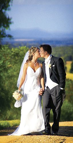 Bride and groom kissing.