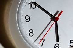 Clock with black hands on a white background, set to 5:50:36 