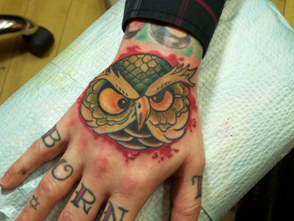 owl on hand tattoo