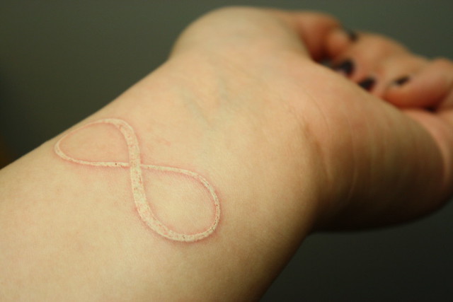 white ink tattoo 2 A white lemniscate on my left wrist about 3 hours old