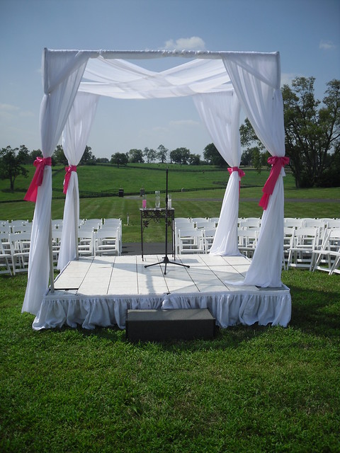 Stage is covered on the top with white dance floor and white skirting around