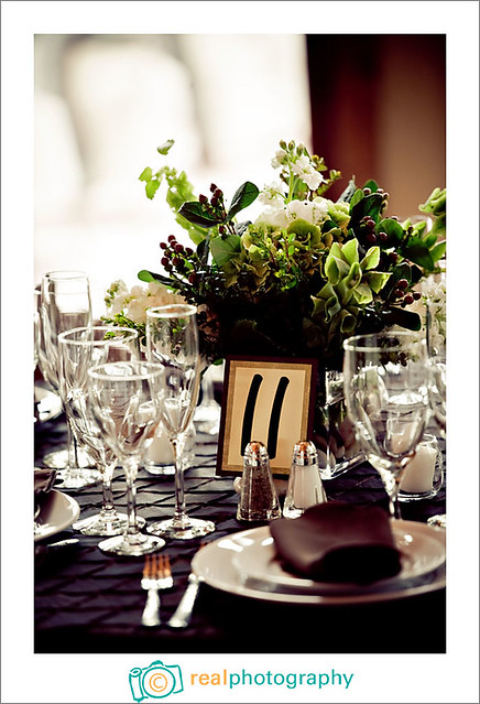 green and brown wedding reception table centerpiece and linens