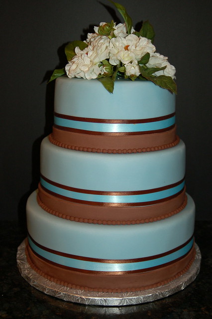 Elegant and beautiful this blue and brown fondant wedding cake by Sweet 