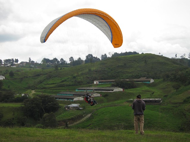 A paraglider comes in for a landing.
