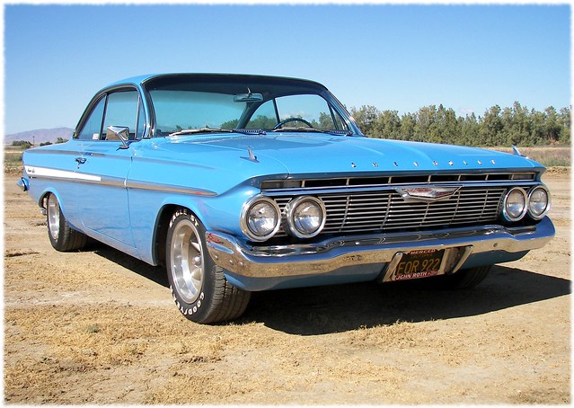 A beautiful blue 1961 Chevy Impala basks in the California sun