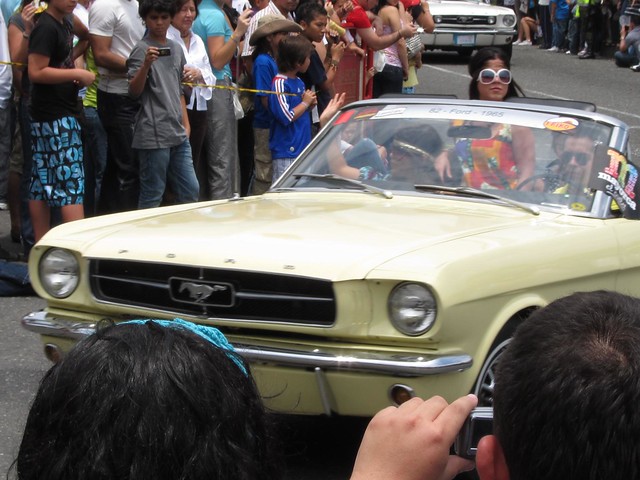 Drivers and passengers dressed in the period of the car they were in, as can be seen with the hippies in this 60's Mustang.