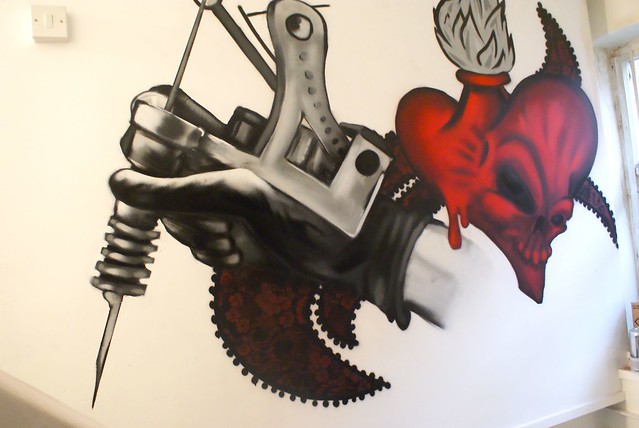 Tattoo gun and heart