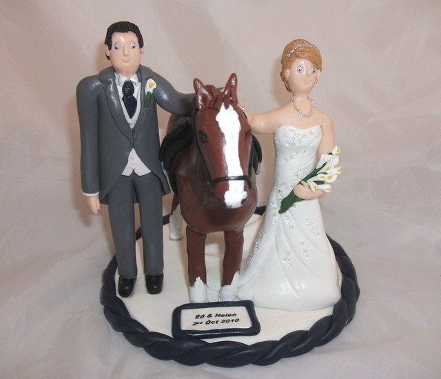 Bride and Groom with their Horse Wedding Cake Toppers