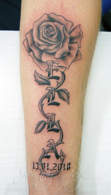 name with rose and vine tattoo Tattooed by Johnny at The Tattoo Studio