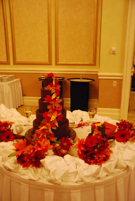 A 5 tier Chocolate Ganache covered wedding cake And mini cake 