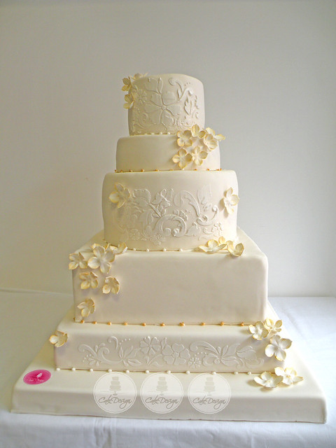 white and gold stenciled wedding cake